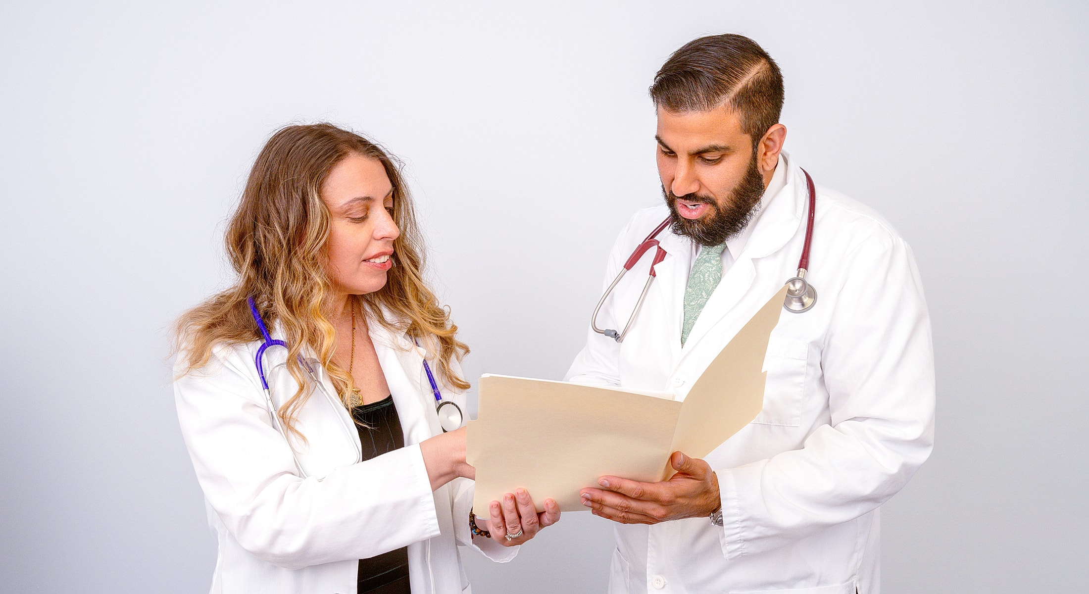 Doctors reviewing patient files together.
